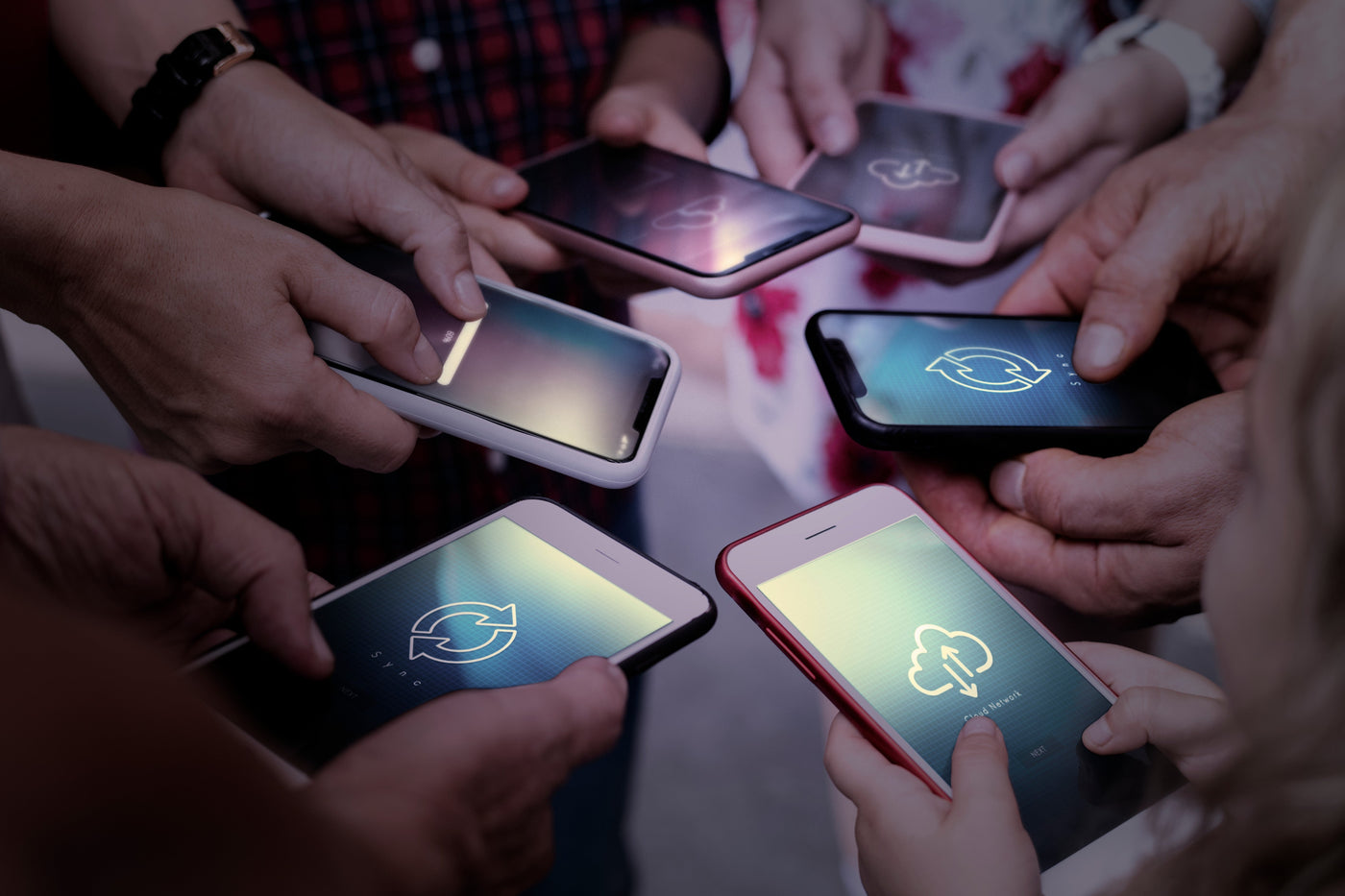 People using smartphones, representing how AI technology powers modern mobile features.